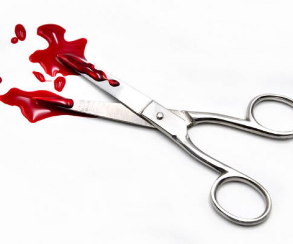 scissors with blood on a white background